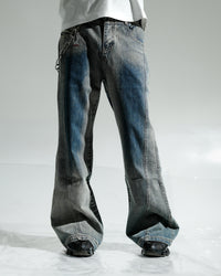 Distressed blue jeans on a white background